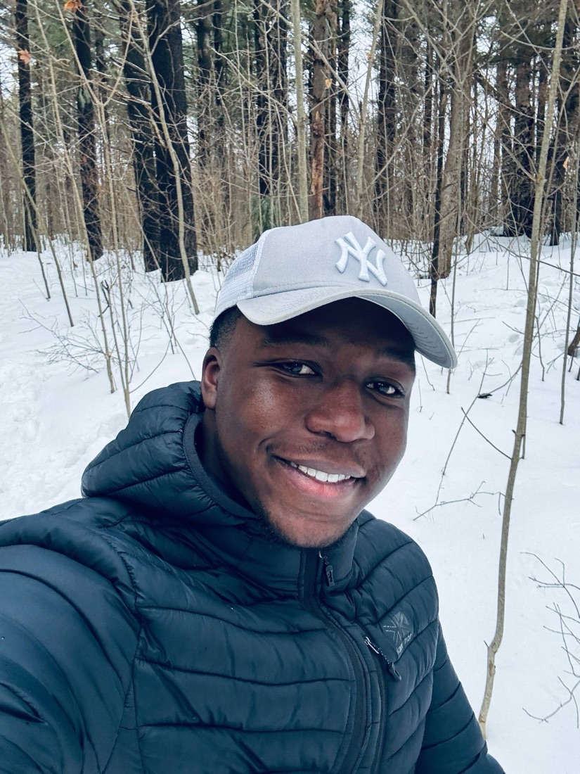 David smiling in a snowy winter forest