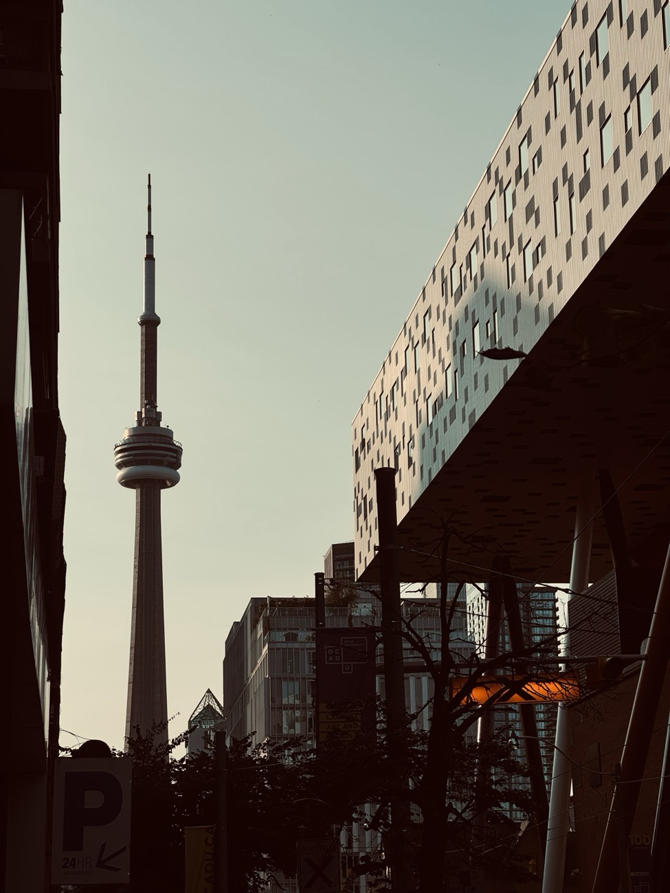 OCAD University's Sharp Centre for Design beside the CN Tower at dusk