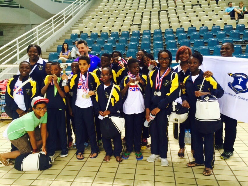 The St. Saviour's swimming team with their medals in the aquatic centre